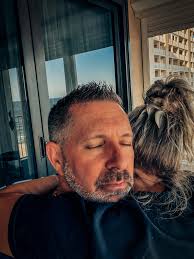 Prompt for Qwen-image, A poster with the heading "HUGGING IS GOOD FOR YOU".  The text is in bold, red letters. Below the heading, there is a bulleted  list of benefits, including lowering