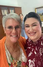 Can anyone put me (in the orange) and the bride together in a photo? She's  my “adopted” daughter (long story) and we didn't get one picture with just  the two of us