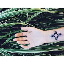 Its a higher or lower score? Zia Sun This Sacred Zia Sun Symbol Is A Little Tattoo That Packs A Whole Lot Of Meaning The Four Dire Sun Symbol Tattoo Zia Sun Tattoo Tribal Sleeve Tattoos