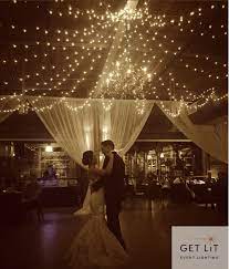 Get Lit Twinkle Light Ceiling Radiating From A Center Point Over Claire Chandelier At The Rickhouse Twinkle Lights Wedding Wedding Chandelier Wedding Lights