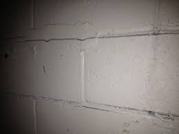 These cracks often start from offset corners (at 90 degrees), then spread out across the room. Horizontal Cracks In Basement Walls Bowing Basement Wall