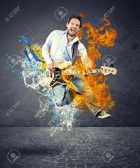 Fire and water live song guitar chords & lyrics by artist free and +65 more. Boy With Bass Guitar Jumps With Fire And Water Stock Photo Picture And Royalty Free Image Image 32752106