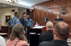Arrest report: Eatherly reached for gun in argument before fight outside County Courthouse