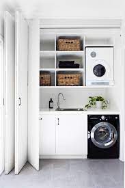 9 Stylish Solutions For Small Spaces Laundry Design Small Laundry Rooms Laundry In Bathroom