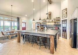 Another example of a farmhouse style with a modern twist, this kitchen is both beautiful and functional. Rustic Kitchen Island Ideas Designing Idea
