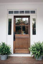 Get the modern farmhouse look by adding farmhouse style interior door knobs. 20 Beautiful Farmhouse Stained Wood Doors House Exterior Modern Farmhouse House Design