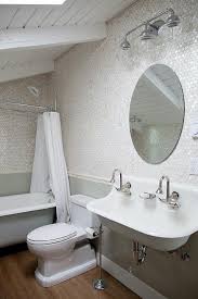 Plenty of clutter, bookshelves, sofa and rugs in there but no room treatment. Attic Bathroom Sloped Ceiling Design Ideas