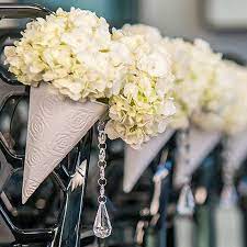 With a makeshift ceiling, the design possibilities (floral chandeliers, real chandeliers and more) are truly endless. Wedding Aisle Flower Cones Pew Cones Wedding Decorations Flower Holders Chair Flower Holder Cones Weddi Flower Cones Unique Wedding Flowers Wedding Flowers