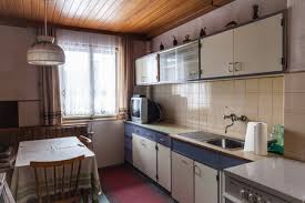 Here is a one way gallery kitchen with red, glossy storage units. Interior Of An Old Simple Kitchen That Should Be Renovated Stock Photo Picture And Royalty Free Image Image 46327703