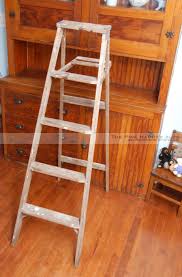 Wooden blanket ladders are full of farmhouse charm, but they can be utilized in other decorating styles as well, make them really versatile. Upcycle Old Wood Ladder Into Bookshelf Diy Rustic Home Design The Pink Hammer Blog