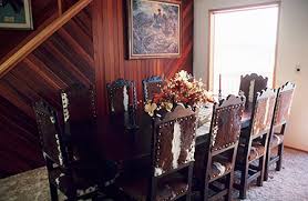 Woven dining chairs dining room cowhide chair safari chic cow hide organic modern interior inspiration wicker accent chairs. Decorating Studio Dining Room Furniture