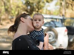 Costa Rica Guanacaste Mother Kisses Her Baby Mother With Baby Traveling With Car Hire In Costa Rica Stock Photo Alamy
