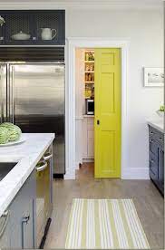 Find layout ideas for a narrow kitchen, plus break up a long run of units using colour sections, like this yellow and white minimalist kitchen. Decorating Yellow Grey Kitchens Ideas Inspiration