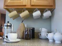 10 Ideas To Save Space In The Kitchen Rangement Pour Tasses Crochet Adhesif Idees De Rangements