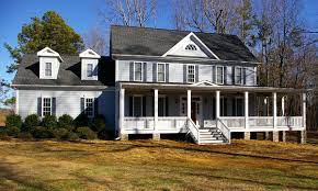 A hallmark of farmhouses, the wraparound porch is a welcoming design feature that spans at least two sides of the home. Wrap Around Front Porch Addition Home Addition Ideas