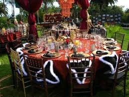 Another great pirate decoration that you can either use with the beach backdrop or as a window cling is the pirate skeleton, fatal treasure and pirate treasure. Love Those Outdoor Hanging Red Curtains Chandelier And The Cluttery Full Tables Def Looks Piratey Movie Themed Party Caribbean Party Pirate Decor