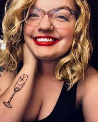 Hi all! I just wanted to introduce myself and share a photo I took. I'm  Kate 😁 Was wondering if anyone else had Swiftie inspired tattoos? This is  my one for champagne