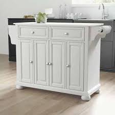 The stylish light gray center kitchen island is partnered by three tolix bar stools and stylish pendant lights. White Granite Top Alexandria Full Size Kitchen Island Cart In Multiple Finishes With Included Spice Rack And Towel Bar Measuring 52 W X 18 D X 34 H By Crosley Furniture
