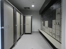 Separate the toilet area from the tub and sink zones with a partition. Gym Changing Room Renovations Cubicle Systems
