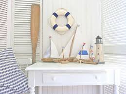 Sailboat decoration as tabletop centerpiece decor for nautical or ocean parties. Diy Nautical Decor That Makes A Splash