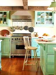 A pale shade covers the walls and ceiling while a deeper shade is used on the cabinets. Small Beach House Kitchen Ideas