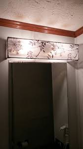 Diy Vanity Light Shade Dowel Rods And A Curtain Sheer Hot Glued And Hung Over Existing Vanity Light Bathroom Light Shades Bathroom Light Bar Diy Vanity Lights