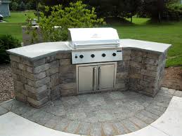Before determining size, decide on the amenities you will include in your outdoor kitchen. Kitchen Remodeling Ideas And Curved Stone Built In Cabinet With Stainless Steel Swing Door Simple Outdoor Kitchen Small Outdoor Kitchens Outdoor Kitchen Grill