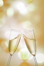 Men and women celebrating birthday or new years party while clinking glasses with group of women and men celebrating with champagne. Clinking Champagne Glasses Stock Photo Dissolve