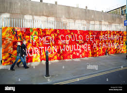 Anti Abortion Street Art Slogan Sewn In To A Knitted Woven Hanging On Brick Lane In East London Stock Photo Alamy