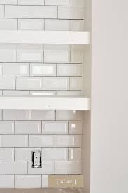 Here, a traditional subway tile with white grout is a perfect neutral backsplash against the blue cabinetry. White On Edges Tips For Dark Grout Craftsman Bungalow Renovation Beveled Subway Tile Beveled Subway Tile Beveled Subway Tile Kitchen White Beveled Subway Tile