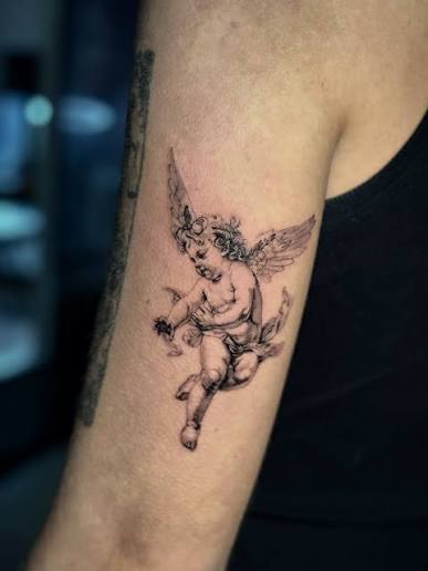 Not your typical angel energy… 👀 A cherub tattoo isn't just cute—it's a symbol of protection, rebellion, and a little bit of mischief wrapped in innocence. Wings soft, meaning sharp. What does