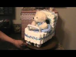 We used 10 for our base tier and another five for the top layer. Baby Diaper Stroller Diaper Stroller Baby Shower Diaper Cake Baby Diaper Cake