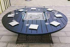 It can also feature as one of the most stunning showpieces in a home. Patio Outdoor Dining Table With Fire Pit