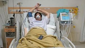 Fasten the gown together, either by tying a firm knot with the attached ties. The Struggle To Keep India S Covid 19 Patients Breathing Bbc News