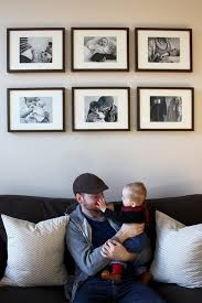 Black And White Family Photo Gallery Wall Love The Black White Baby Family Photos Framed A Abovecouch Babyfamily Black Framed Family Photo Frames Black And White Baby Boho Style Room Decor