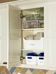 7 Tricks For Taming Your Cabinet Of Food Storage Containers Tupperware Organizing Cabinets Organization Kitchen Organization