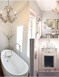 Modern elements like the freestanding tub and vessel sinks mix with eclectic and bohemian touches, including leather cabinet pulls, patterned concrete tile and a traditional carpet. Bathroom Decor Inspiration Chandeliers Yesmissy