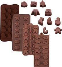 This is a christmas silicone light mold made from some beads. Amazon Com 4 Pack Christmas Silicone Molds Christmas Chocolate Candy Trays Baking Jelly Molds For Party Cake Decoration With Various Christmas Themed Shapes Kitchen Dining