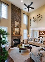 Two Story Great Room Windows Fireplace Would Not Have The Half Wall Separating The Great Room High Ceiling Living Room Family Room Design Home Living Room