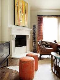 Warm orange partnered with brown makes this living room look cozy and inviting. Orange Living Rooms Living Room Paint Color Living Room Paint Color With Orange Wall Dubai Khalifa