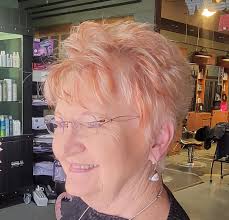 Hairstyle and color for women over 50 with natural red hair