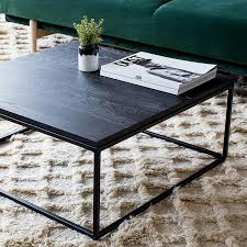 A heavy aged mirror sits on the surface providing the stunning texture. Ethnicraft Oak Thin Coffee Table Black Curious Grace Black Coffee Tables Coffee Table Stainless Steel Coffee Table