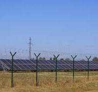 Solar Power Plant Fenced with a High Fence with Barbed Wire ...