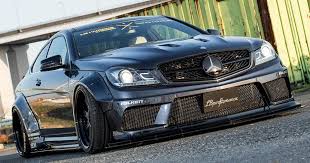 Mercedes Amg C63 Coupe And Sedan Graduate From The Liberty Walk Academy Carscoops Mercedes Amg Mercedes Mercedes Benz Amg