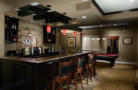 The bar's angled layout allows more seating and is better for conversation and tv viewing. These 15 Basement Bar Ideas Are Perfect For The Man Cave
