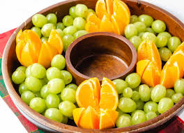 Create an outline of a tree shape using the grapes on a cutting board or serving platter. Christmas Fruit Platter An Easy Holiday Fruit Wreath Keeping The Peas