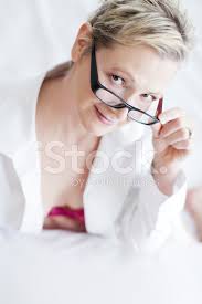 Photographic studio session for a 50 year old woman sitting on the floor and dressed in jeans and white shirt Sexy Beautiful 50 Year Old Woman On A Bed Stock Photos Freeimages Com
