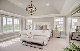 A Large Circular Light Fixture Perfectly Pops Against The Light Colors In This Relaxing Bedroom Master Bedroom Lighting Rustic Master Bedroom Remodel Bedroom