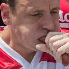 Defending champ Chestnut sets record with 74 hot dogs