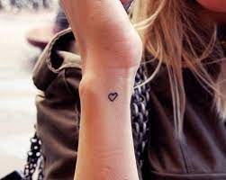 Hidden small tattoo heart on the heel. 60 Small And Simple Wrist Tattoos For Women Side Wrist Tattoos Wrist Tattoos Girls Tiny Heart Tattoos